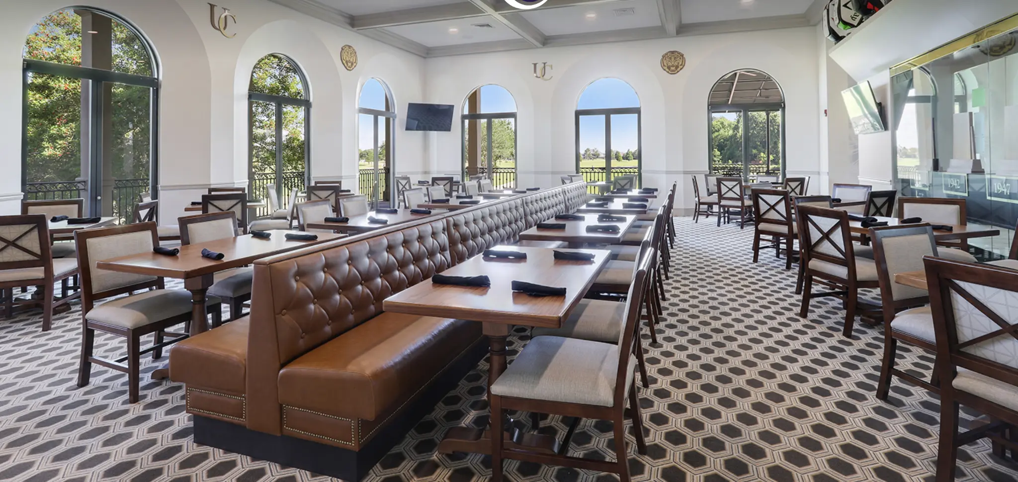 University Club dining room with arched windows overlooking the course