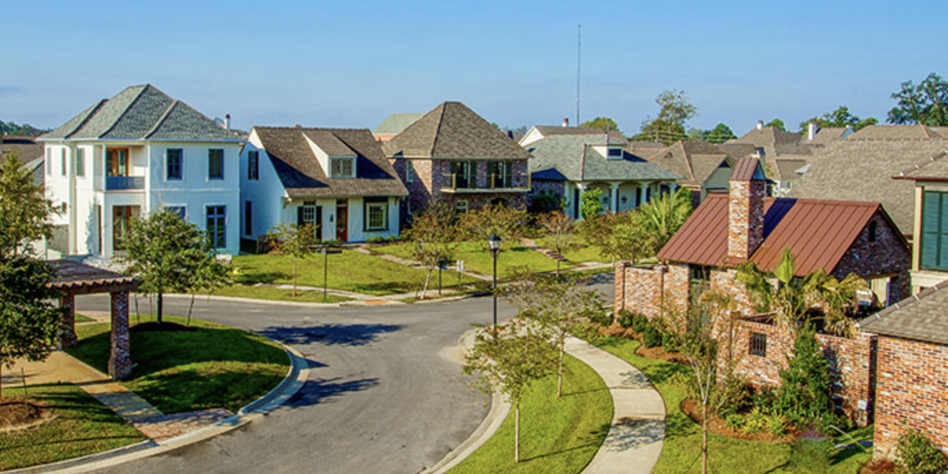 Aerial view of Willow Grove homes — colorful Creole-style architecture